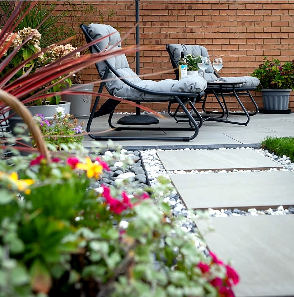Small landscaped garden with paving and planting