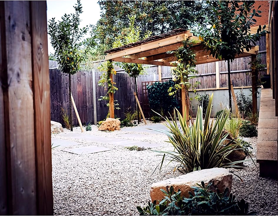 Pergola over a gravel garden seating area