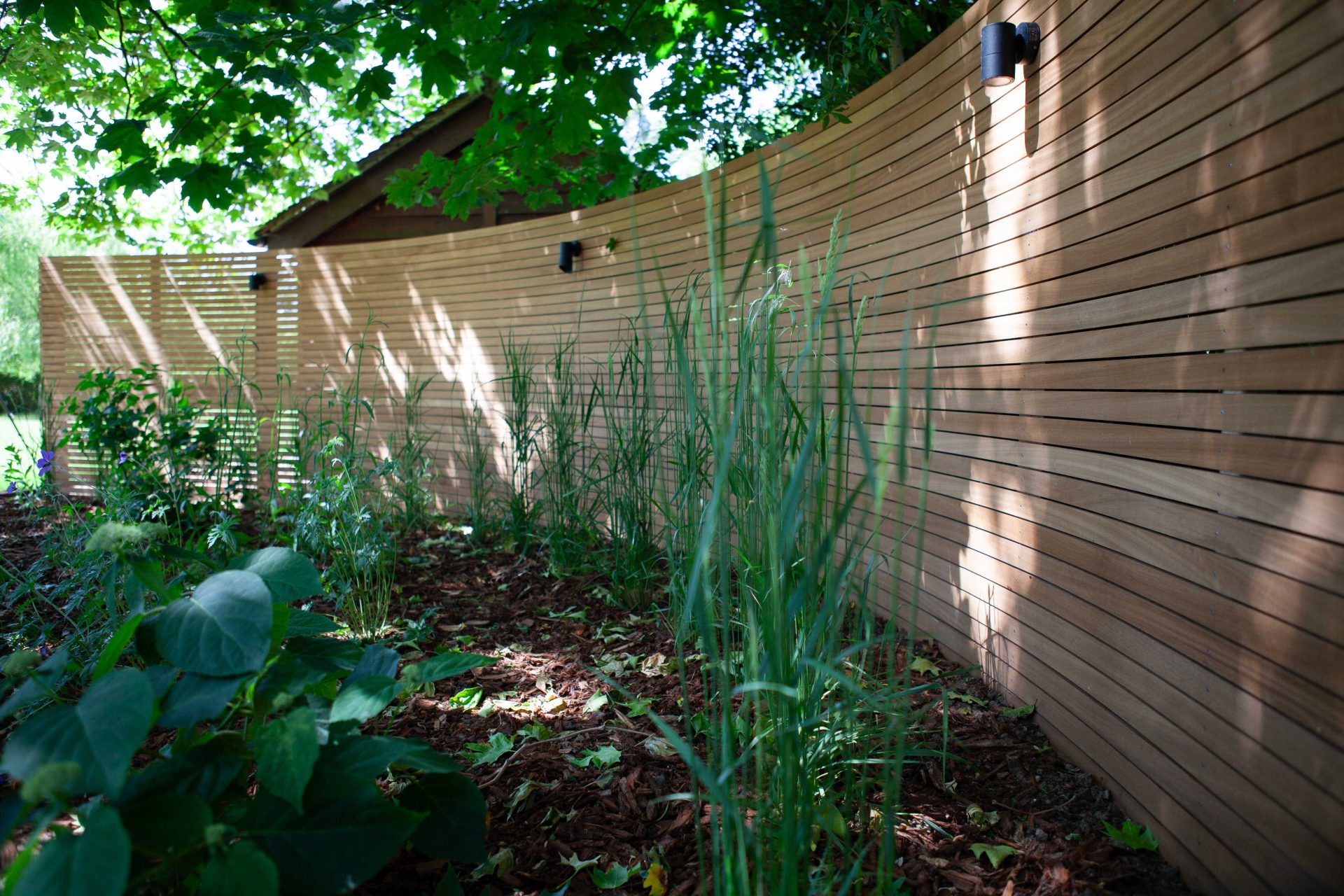 Wide view of the finished Ardley garden for the Stone Terrace & Brick Detail project.