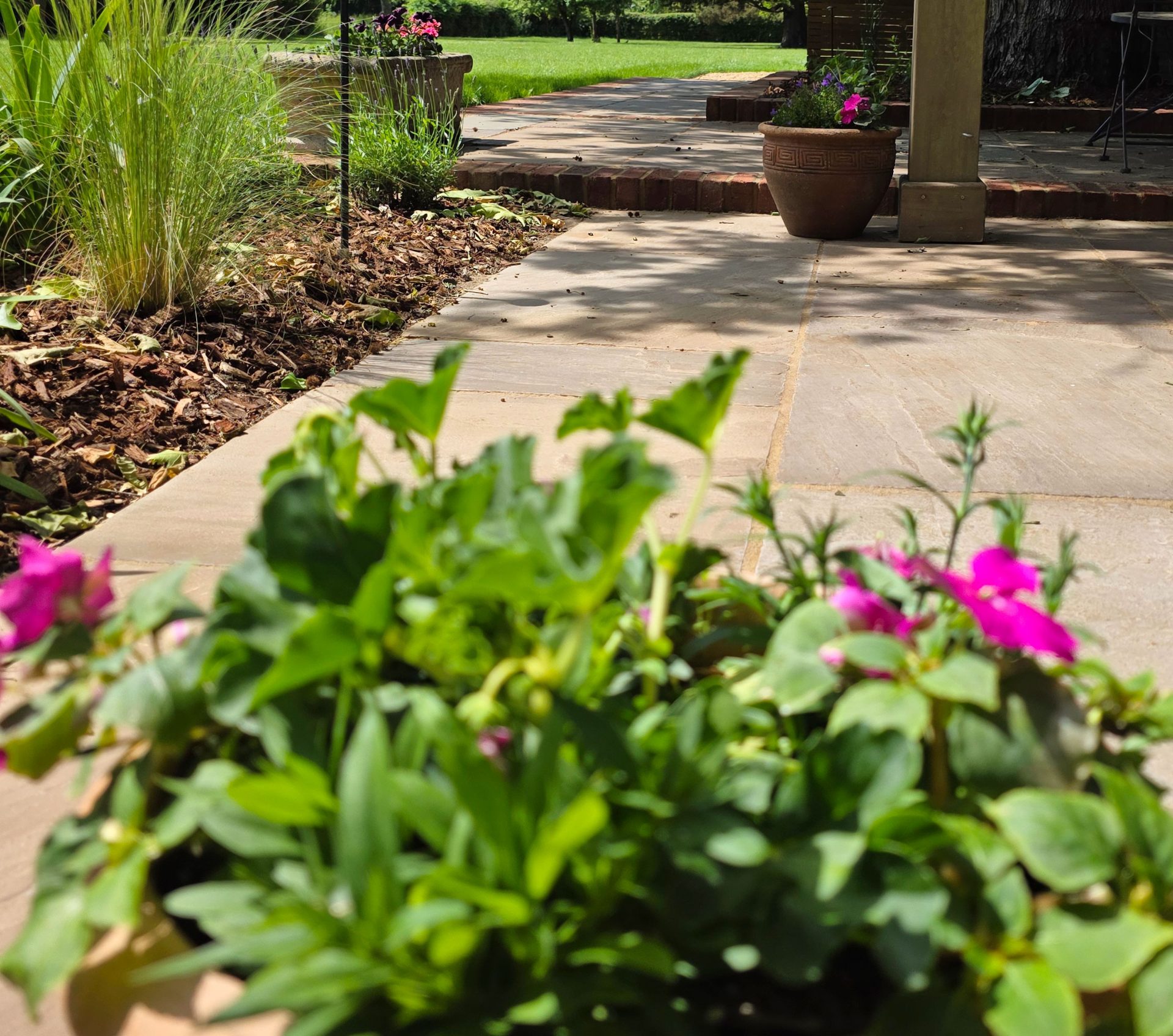 Wide view of the finished Ardley garden for the Stone Terrace & Brick Detail project.