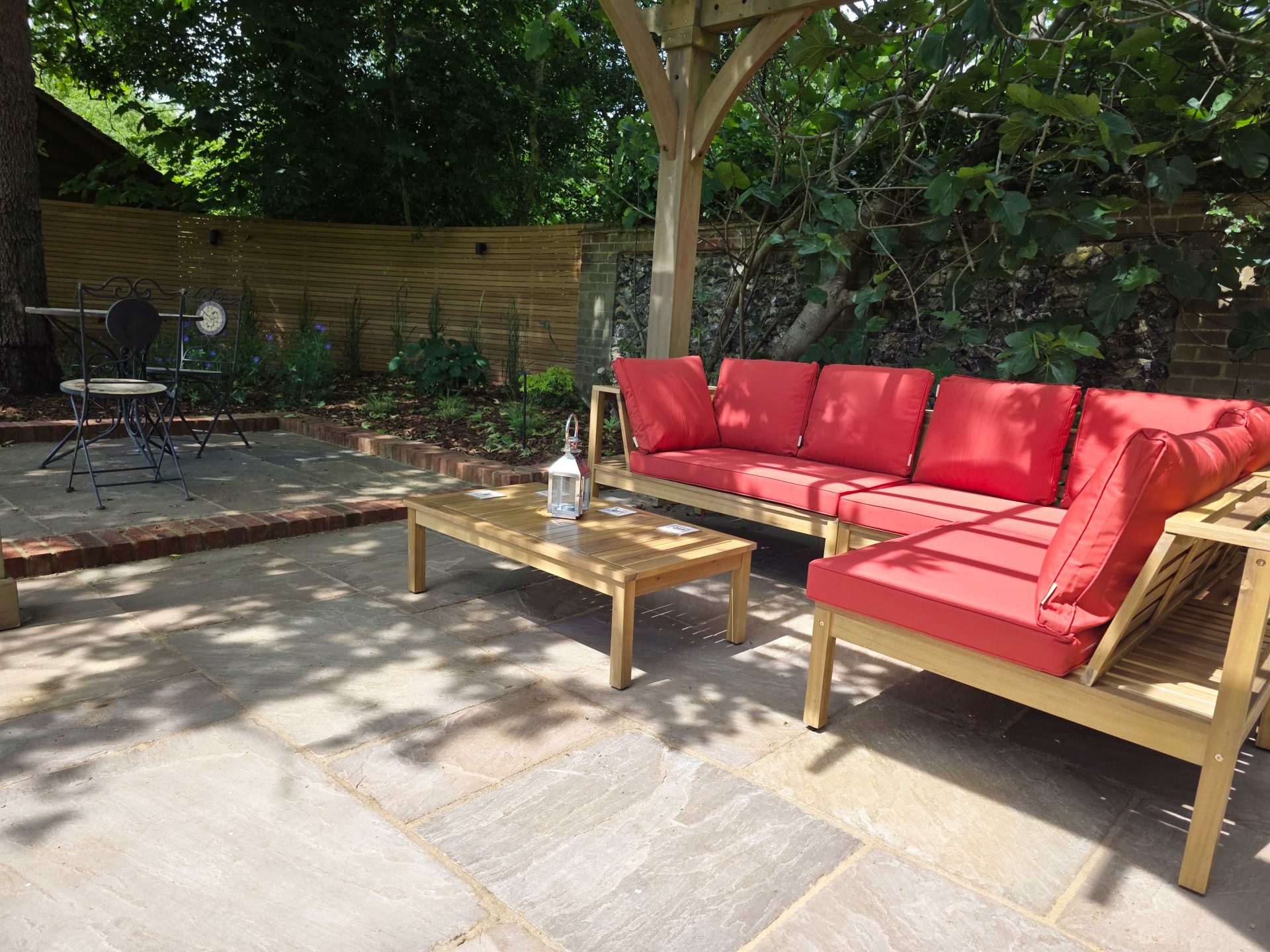 Wide view of the finished Ardley garden for the Stone Terrace & Brick Detail project.