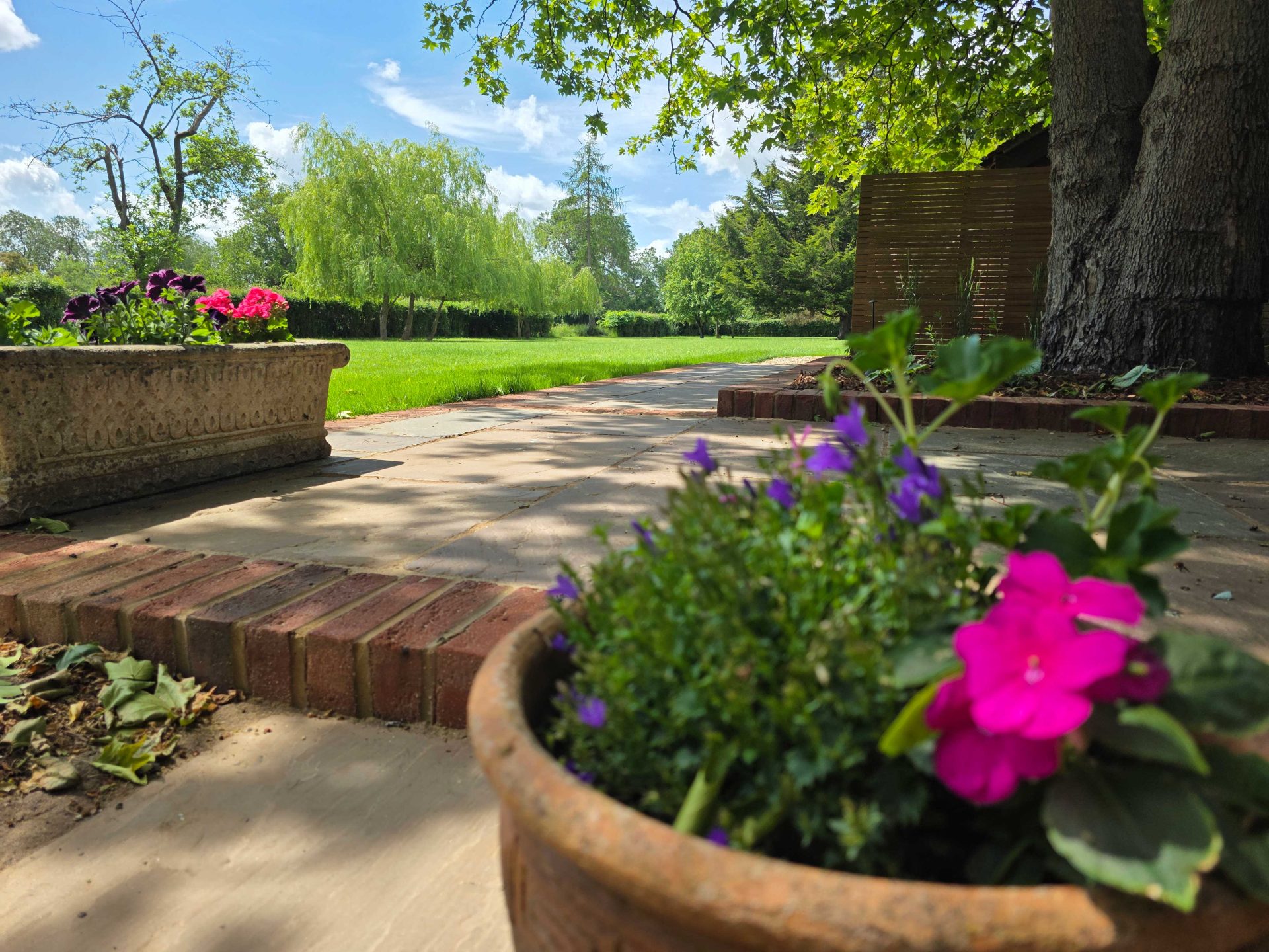 Wide view of the finished Ardley garden for the Stone Terrace & Brick Detail project.