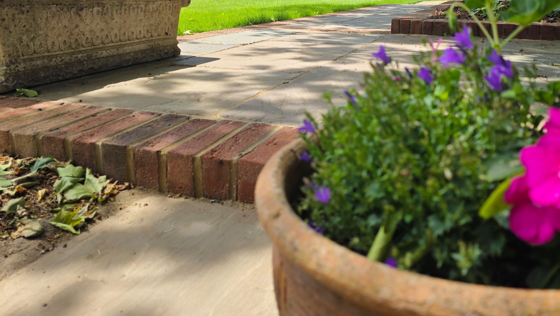 Wide view of the finished Ardley garden for the Stone Terrace & Brick Detail project.