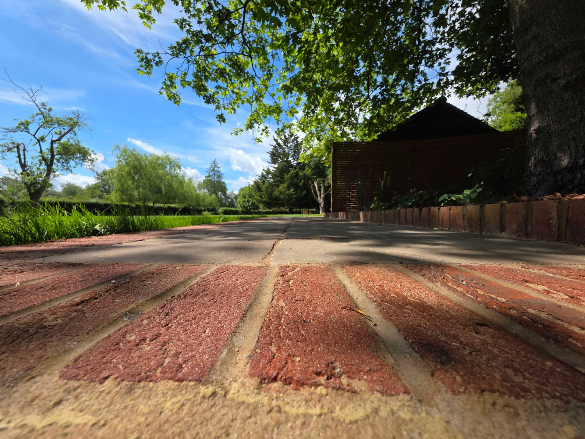 Wide view of the finished Ardley garden for the Stone Terrace & Brick Detail project.