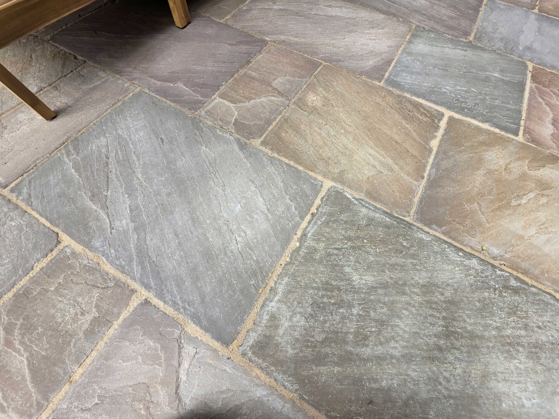 Wide view of the finished Ardley garden for the Stone Terrace & Brick Detail project.