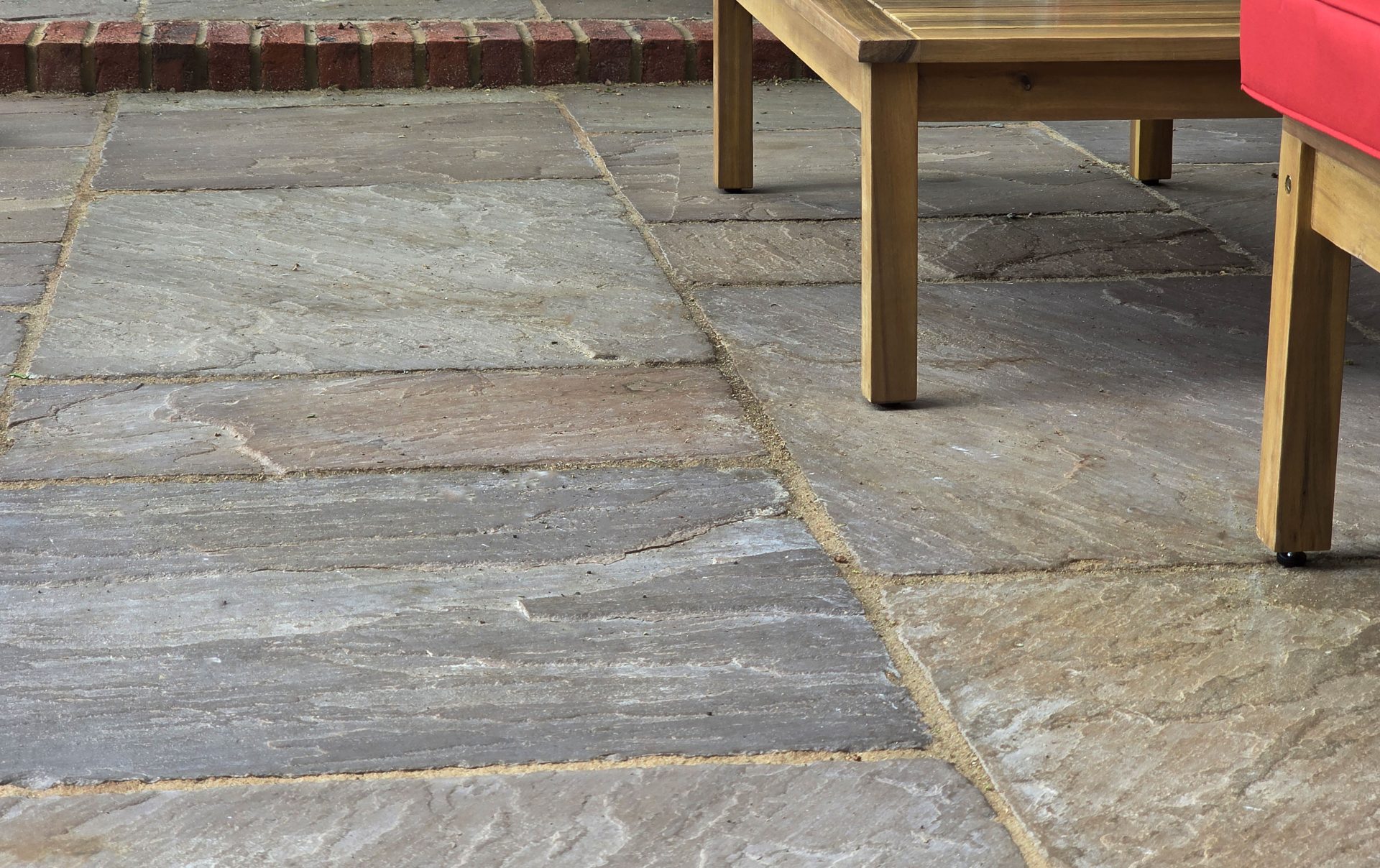 Wide view of the finished Ardley garden for the Stone Terrace & Brick Detail project.