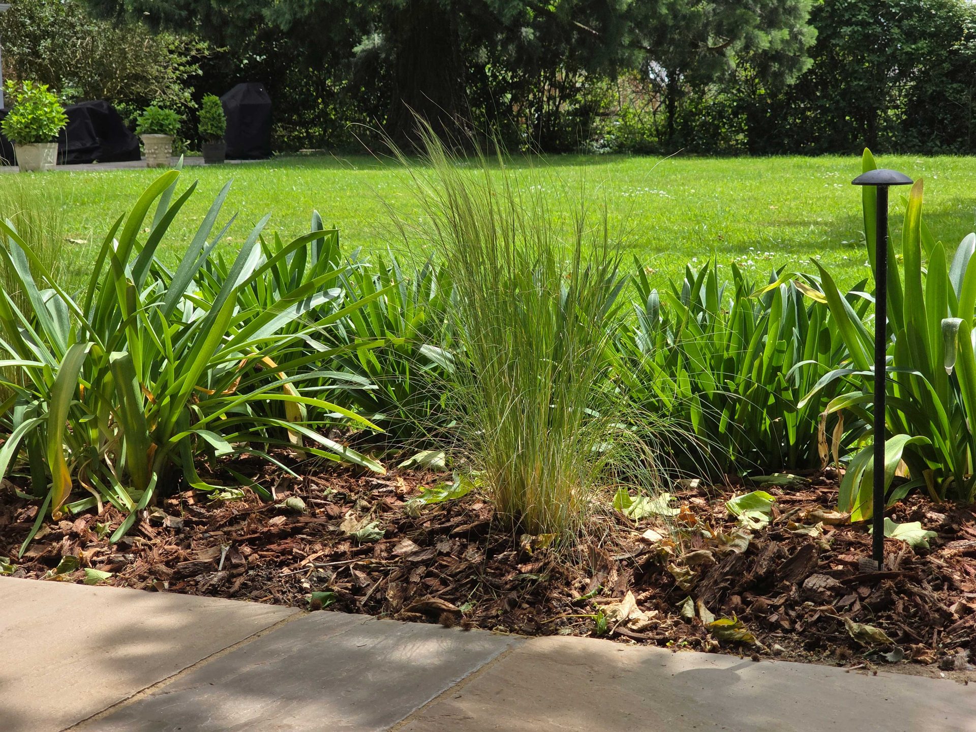 Wide view of the finished Ardley garden for the Stone Terrace & Brick Detail project.