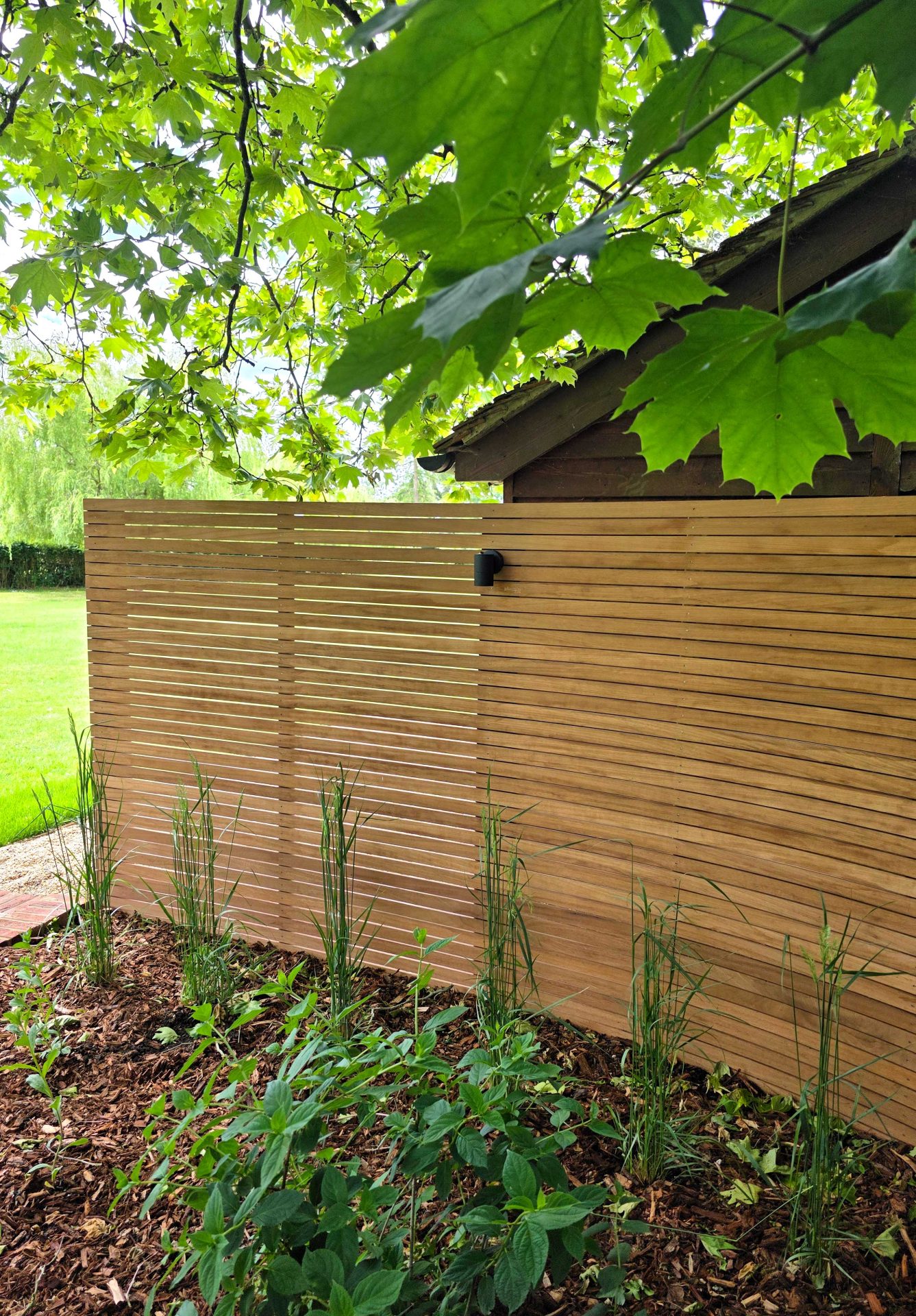 Wide view of the finished Ardley garden for the Stone Terrace & Brick Detail project.
