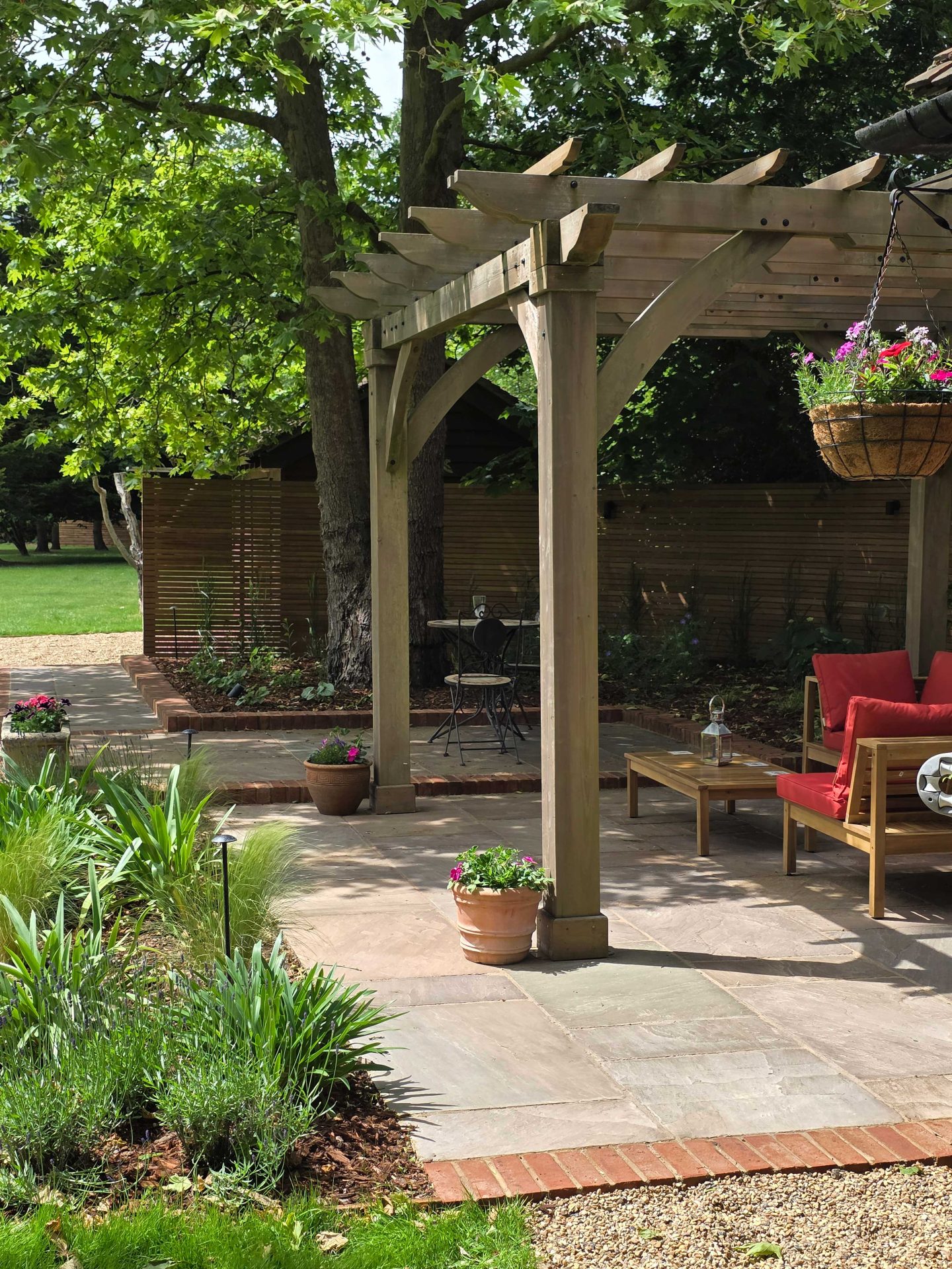 Wide view of the finished Ardley garden for the Stone Terrace & Brick Detail project.
