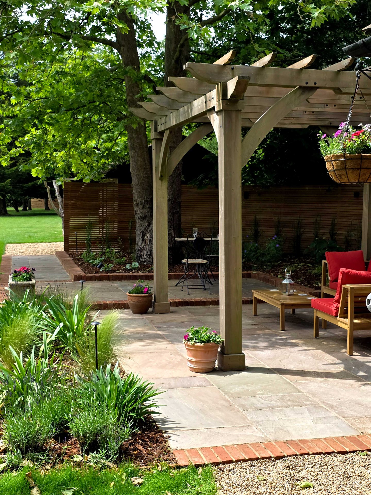 Wide view of the finished Ardley garden for the Stone Terrace & Brick Detail project.