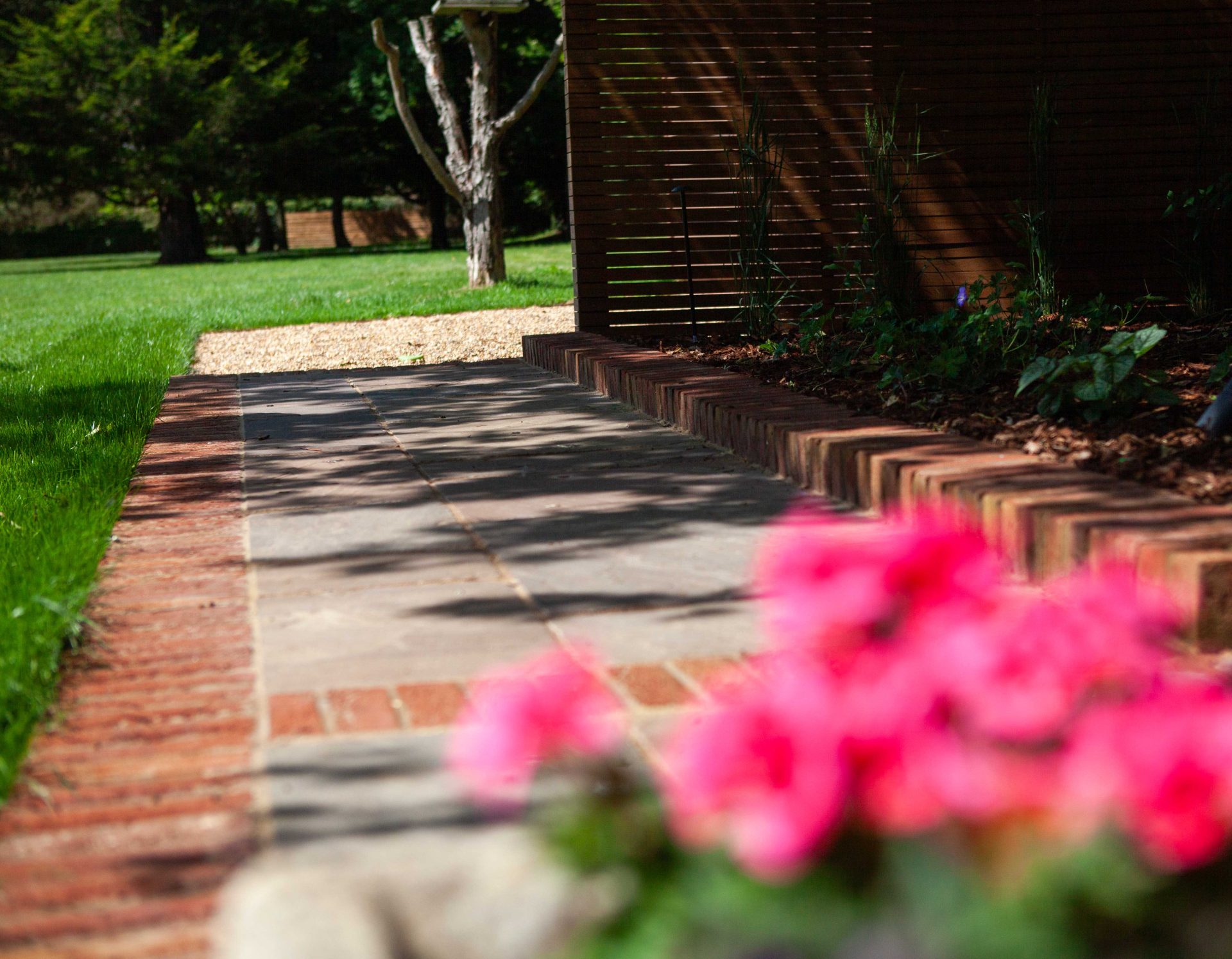 Wide view of the finished Ardley garden for the Stone Terrace & Brick Detail project.