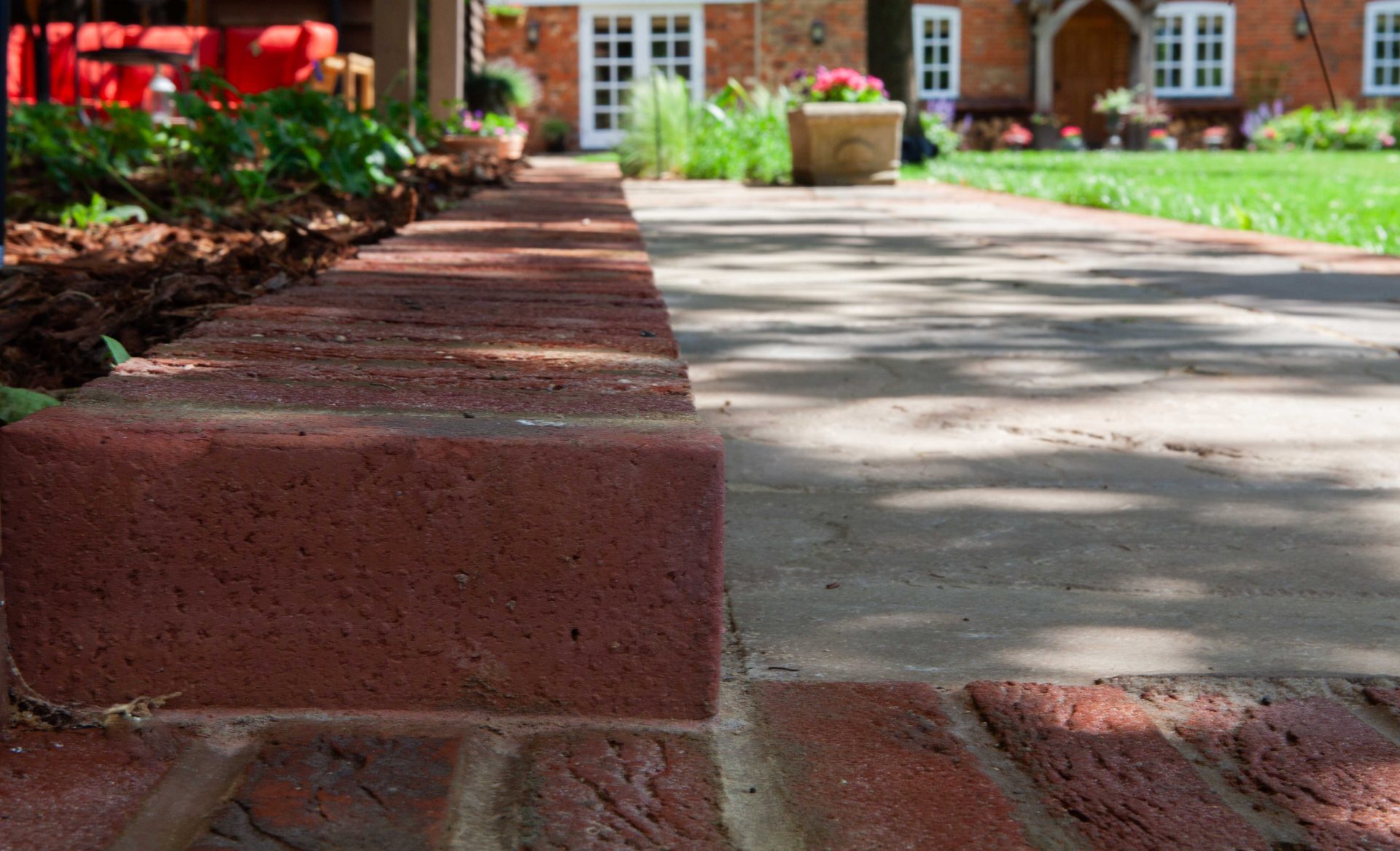 Wide view of the finished Ardley garden for the Stone Terrace & Brick Detail project.