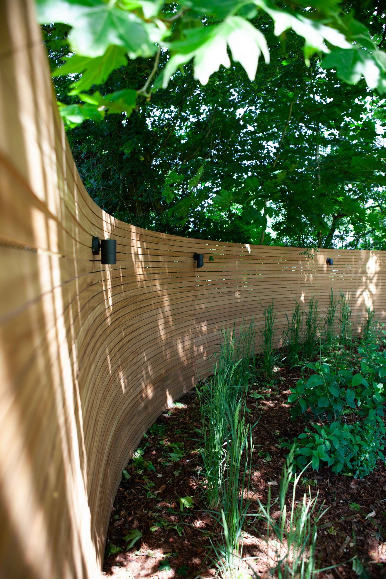 Wide view of the finished Ardley garden for the Stone Terrace & Brick Detail project.