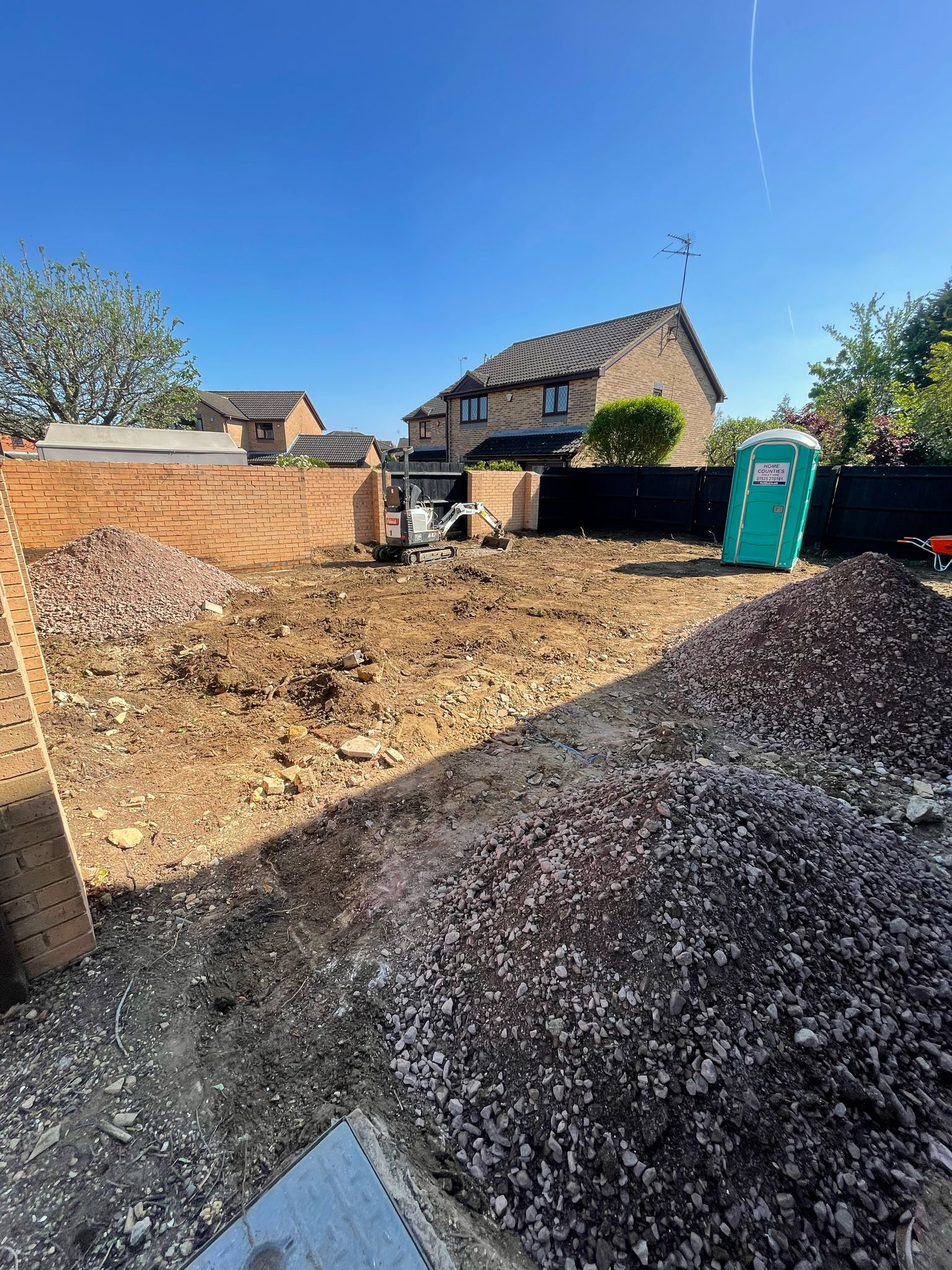 Garden before the Three Patios & Central Lawn landscaping project in Luton.